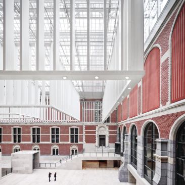 In the eastern courtyard, staircases lead to the galleries in the historic building.