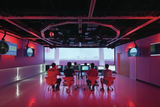 The creativity studio allows students to explore digitally projected environments; a ceiling-mounted system of movable partitions, as well as theatrical lights and projectors, allow for the space to be reconfigured.