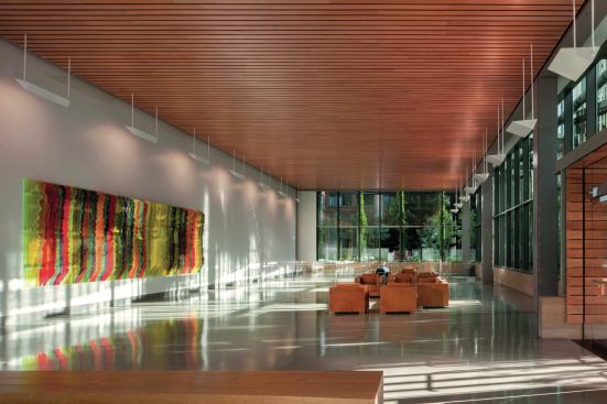The lobby, with its terrazzo floors and ceilings from 9wood, is lined with floor-to-ceiling glazing from Viracon.