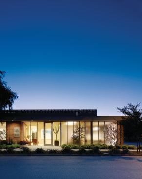 The institutional existing brick facade of Dosart Development Co. was opened up on the street side to allow in natural light while still providing a degree of privacy.