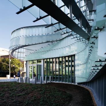 The General Services Administration commissioned Schwartz/Silver Architects and CDFL Architects to modernize the building systems and interiors of the Dr. A.H. McCoy Federal Building in Jackson, Miss. The renovation included the addition of a curved entry pavilion clad in glass and metal panels.