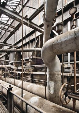 Massive ductwork that used to contain and direct the flows of super-heated steam was removed to make way for two new floor slabs, dividing the once 75-foot-high space into three classroom levels.

