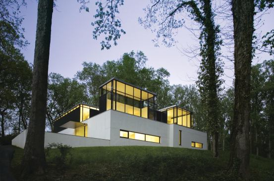 A series of Miesian boxes fill the interior spaces with natural light.