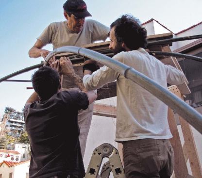 The fabrication team learned the art of bamboo lashing to hold the structure's tension frame together, but ended up using duct tape, which proved easier to work with.