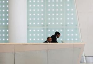 The interior lobby wall (above) features white LEDs sandwiched between glass panels to create a dynamic visual effect.