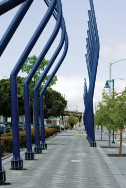 Hood’s design for the 2.5-acre stretch of Seventh Street encompassing the West Oakland BART station includes pedestrian “dancing lights” and other features to reconcile the site’s industrial-rail past and gentrified-corridor future.