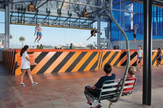 Skilift chairs suspended from catwalk.