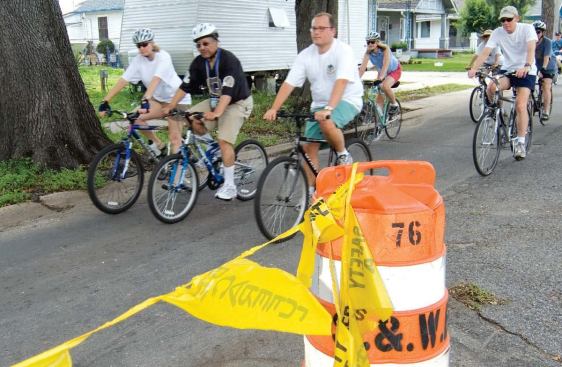 Wearing a New Orleans Saints jersey, Ed Blakely leads a public bike ride through the Riverbend and Carrollton neighborhoods, June 3, 2007.