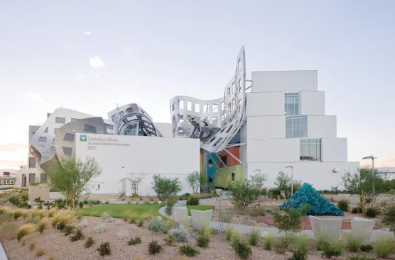 Although architect Frank Gehry's sources are never strictly literal or singular, sand dunes of the desert suggested the twisting volumes of the four-story event hall.