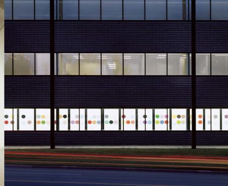 Renee Van Helm’s '100 Years of Color' lines the hallway; each disc represents the most popular color from a year of the 20th century.