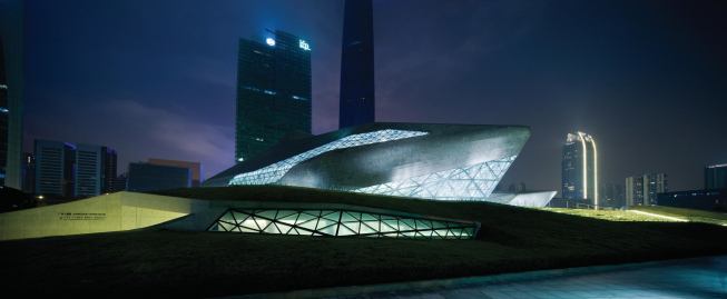 Supported by a steel framework, the structural skin features a series of triangular panels—white and black granite (75,422 pieces in all) and glass.