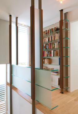 The shelves even make their way upstairs to a second-floor nook.