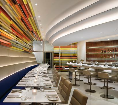 The restaurant references Frank Lloyd Wright's museum but also manages to stand apart as a striking contemporary space. 








