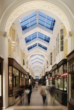 Custom LED fixtures are integrated into the skylights and fitted with louvers to minimize their impact. 