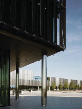 The entire nine-building campus was designed by the same team, allowing the glass and steel vernacular to be carried through from the headquarters tower to the other buildings. The complex is programmed to encourage movement back and forth between structures (and thus interaction among employees).