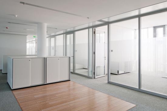 The majority of the interior finishes and furniture on the office floors is white, in order to reflect the daylight and maximize its throw into the floorplate.