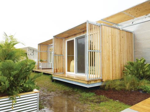 Students designed FLeX House in a simple rectangular form and used inexpensive finish materials like corrugated metal and wood siding.