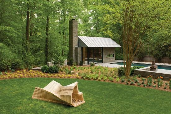 Intended for year-round use, the pavilion is set close to the woods, providing a threshold between the manicured gardens and adjacent woodland.