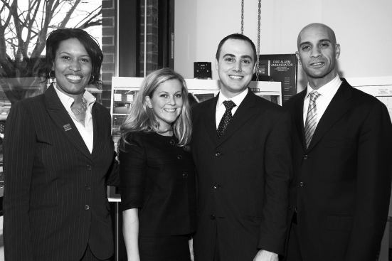 Interior designer Dana Mathews and project manager Gavin Daniels at the center's dedication, flanked by D.C. Councilwoman Muriel Bowser and Mayor Adrian Fenty.