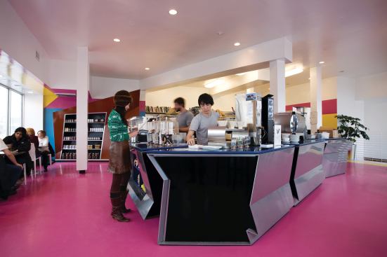 The custom counters were designed by Zago Architecture and fabricated locally. The laser-cut steel was powder-coated silver to give it a shine that reflects the surrounding colors, without resorting to a more expensive material that would have taken the project over budget. They also designed the butterfly display case on the back wall to ply the café’s wares.