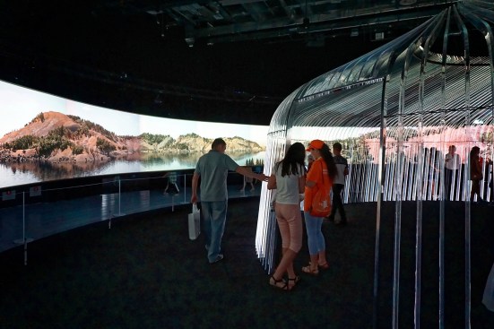 The UK Pavilion consists of an interactive structure that triggers evolutionary changes in a CGI landscape.