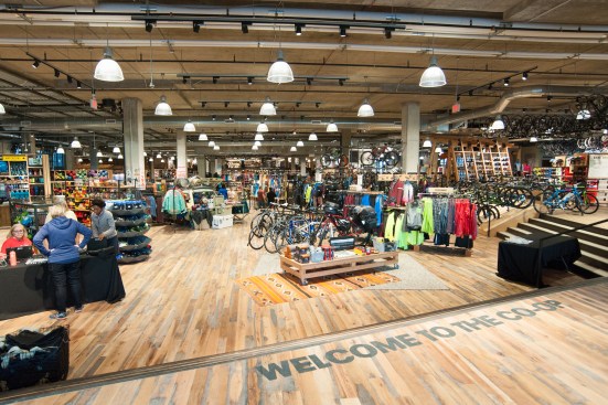 With the exception of the on-grade entrance and adjacent bike shop, the 50,000-square-foot arena floor was excavated 5 feet to achieve the volume REI requires of its locations to display large outdoor gear such as kayaks and canoes.