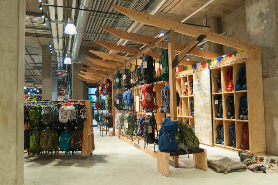 The backpack shop offers a fit table and a shelf of gear for customers to test how much a pack can hold.