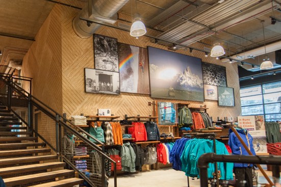 REI minimized the use of conventional interior finishes, such as drywall, opting instead for a “gear garage” look, says REI’s Elizabeth Dowd. T1-11 panels, cut and oriented to form a makeshift herringbone pattern, serve as the backdrop for the Patagonia shop.