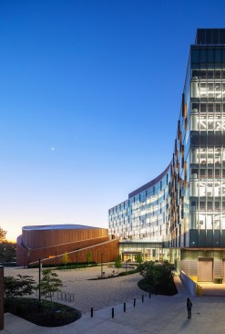 The building's oval-shaped form contains two stacked auditoriums and resembles a terrapin, the university's mascot.