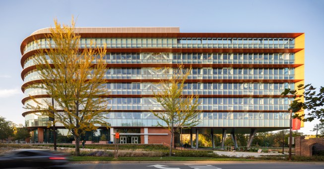 Copper-colored fins provide shading on the building's south face.