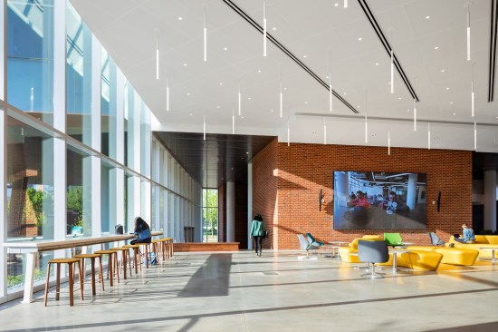 Eighteen-foot-tall windows on the first floor offer expansive views of the surrounding landscape