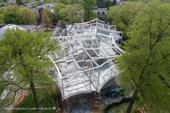 A box-kite-inspired structure forms the upper two stories of the Winter Visual Arts Center, which sit on a cast-in-place concrete base. 