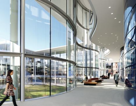 Circulation space around the building’s central courtyard is programmed as flexible gathering space.